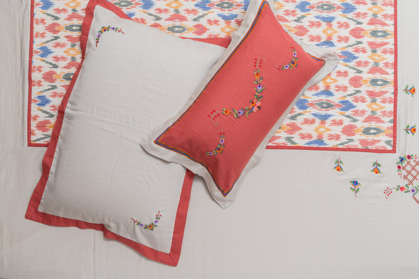 Off white and Coral Ikkat Embroidered Bedsheet
